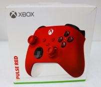 A boxed as new Xbox Wireless Controller in Pulse Red (Box sealed, some damage to box) (EAN: 88984270