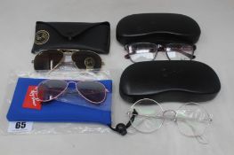 Two pairs of Ray-Ban glasses frames, a pair of Ray-Ban sunglasses and a pair of children's Ray-Ban