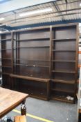 A pre-owned large bookcase with shelves (H- 268cm W- 364cm D- 45cm).