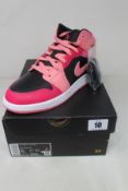 A pair of boxed as new Nike Air Jordan 1 Mid - Coral/Chalk Pinksicle (Junior UK 5.5).