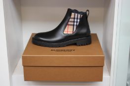 A pair of men's boxed as new Burberry Chelsea boots (Size 42).
