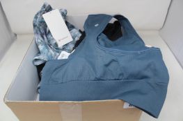 Six women's assorted LuLuLemon sports training bras (Various Sizes) and a pair of LuLuLemon Hotty