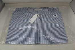 Seven Seersucker white/blue striped blouses (Sizes: 2 x 34, 2 x 36, 1 x 38, 2 x 40).