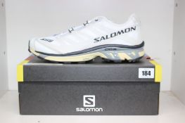 A pair of boxed as new Salomon XT-4 Running Shoes - White/Lunar Rock/Night Sky (Unisex UK 12).