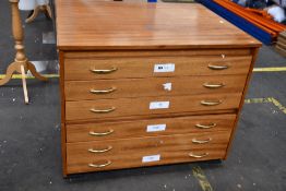 A pre-owned two-section six drawer plan chest.