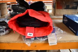 A Patagonia Refugio 30 Litre Backpack - Classic Navy and a Keysmart Urban 21 Commuter Backpack (