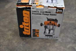 A boxed Triton 2400w dual mode precision plunge router.