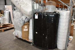 A quantity of rolled mattresses in various makes and sizes.