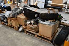 A quantity of car parts and related items to include tyres, exhausts and baby car seat.