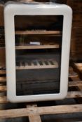 A Klarstein mini wooden shelved refrigerator (Damage to back, viewing advised).
