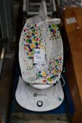 A 4Moms motorised Mamaroo baby rocking chair, missing mobile from the top.