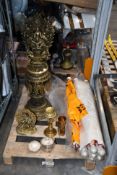 A pre-owned brass religious shrine and related items.