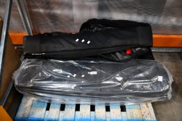 Two Evoc bike travel bags, one as new, one pre-owned.