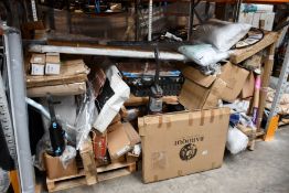 A large quantity of assorted household items to include blinds, flat packed furniture, ironing board