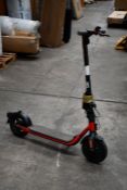 A pre-owned Sedway Ninebot D18E Electric Folding Scooter, black and red