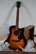 A pre-owned Yamaha FX370C electric-acoustic guitar in tobacco brown sunburst, some damage to front o