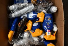 A large quantity of as new sun screen to include Altruist, Piz Buin and Nivea Sun Kids