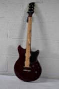 An as new Yamaha Revstar RSE20 electric guitar in red copper
