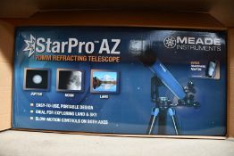 A boxed as new Meade Star Pro AZ 70mm refractor telescope