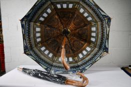 Three black walking automatic opening umbrellas with wooden crook handle and lined with a picture of