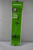 A Greenworks 48V 33cm Line Trimmer and two 2Ah Batteries