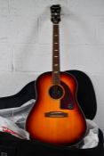 An as new Epiphone Texan FT-79 acoustic guitar with case