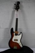 An as new Fender jazz bass guitar in sunburst with carry case