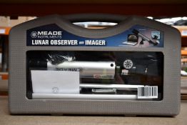 A boxed Meade lunar observer and imager