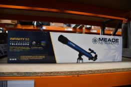 A boxed as new Meade Infinity 50 reflector telescope