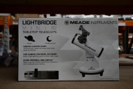 A boxed as new Meade Lightbridge Mini 82 table top telescope