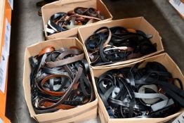 Four boxes of pre-owned belts.