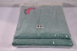 Two Southampton Home Aqua Herringbone throws.