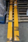 A pair of 6ft forklift fork extensions.