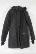A pre-owned Canada Goose Trillium hooded shell down parka (XS).