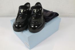 A pair of boxed as new Prada Black Brushed Leather Loafers (EU 40).