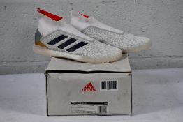 A pair of Adidas Predator 19+TR CO unisex football trainers (UK 8-1/2) (Outer box damaged)