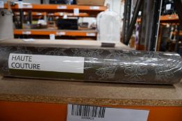 Thirty one rolls of Haute Couture Regency Damask wallpaper.