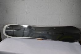 An as new Burton Flying V custom snowboard (154-158cm wide).