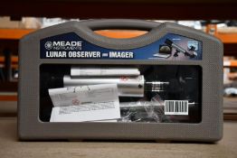 A boxed Meade lunar observer and imager