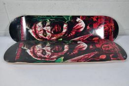 Two skateboard decks with a Damen Leone film Terrifier motif to deck (Slight scuff mark to edges)
