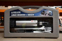 A boxed Meade lunar observer and imager