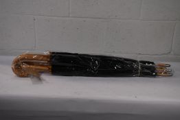 Five black walking automatic opening umbrellas with wooden crook handle and lined with a picture of