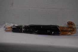 Five black walking automatic opening umbrellas with wooden crook handle and lined with a picture of