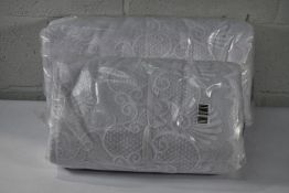 Two rolls of as new patterned net curtains (Size unknown)