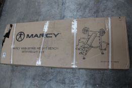 A Marcy MWB-36780B Weight Bench with Weight Set.