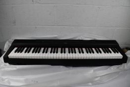 A boxed as new Yamaha P-121B Digital Piano.
