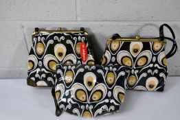 Three M.Andonia handbags.