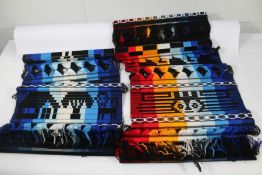 A quantity of Latin American Style Wall Hangings (approximately 45, various designs).