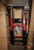 A hydraulic motorcycle assembly stand lift platform, 680kg, central stand, black top