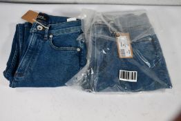 Two pairs of A.P.C jeans (Size 25 and 28).